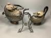 A late 19th century Dutch fluted white metal tea kettle, by Bonebakken & Zoon, with damaged stand and a later similar teapot                                                                                                