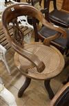 A Victorian caned desk chair                                                                                                           