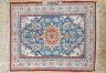 A north-west Persian blue-ground floor mat, signed, 42x53cm                                                                                                                                                                 