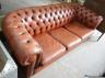 A modern Victorian style buttoned brown leather Chesterfield settee, length 200cm, depth 82cm, height 68cm                                                                                                                  