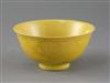 A Chinese yellow glazed sgraffito 'dragon' bowl, Qianlong seal mark and of the period (1736-95), Diam.13.3cm, restored                 