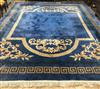 A Chinese blue ground carpet with Greek key border 480 x 365cm                                                                         