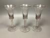 A trio of George III style cotton twist stemmed glasses                                                                                                                                                                     