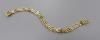 A 9ct yellow gold curb-link bracelet, 18.2cm, 10.9g                                                                                                                                                                         