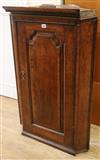 A George III oak corner cabinet W.67cm (a.f.)                                                                                          