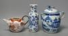 A 19th century Chinese blue and white covered jug, an early 20th century blue and white vase and a Kangxi rouge de fer teapot, tallest 18cm                                                                                 