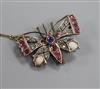 A Victorian yellow metal and multi gem set bug brooch, 40mm.                                                                           