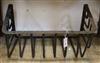 A wrought iron wall mounting hay rack W.67cm                                                                                           