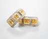 A modern pair of 14k yellow metal, diamond chip and triple cluster yellow sapphire? set half hoop earrings, 19mm, gross weight 6.9 grams.                                                                                   