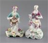 Two Derby 'Pale Family' seated figures of a gentleman and a lady, c.1756-8, h. 13.3cm and 13.8cm, restorations                         