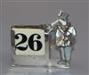 A George V silver, mother of pearl and ivory desk calendar, London, 1931, 7.2cm.                                                       