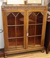 A carved oak glazed display cabinet W.106cm                                                                                            