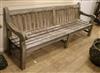 A large wooden garden bench W.240cm.                                                                                                   