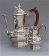 A George V silver bachelor's coffee pot and matching cream jug, Mappin & Webb, Sheffield, 1933, 21 oz.                                 