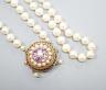 A 1960's double strand cultured pearl necklace, with 9ct gold, amethyst and cultured pearl set clasp (a.f.), approx. 40cm                                                                                                   
