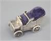 A rare Edwardian novelty silver pin cushion modelled as a vintage car, with rotating wheels, by Levi and Salaman, 54mm.                