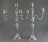 A pair of Edwardian silver two branch three light candelabra by Mappin & Webb, 48cm.                                                   