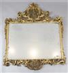 A late Victorian giltwood and gesso wall mirror, W.4ft 8in. H.5ft 1in.                                                                 