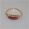 An early 20th century 18ct gold and graduated five stone ruby half hoop ring, size Q.                                                  