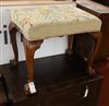 A walnut dressing stool, with claw and ball feet W.59cm                                                                                