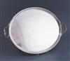 A George V silver oval two handled tea tray by Thomas Bradbury & Sons, 56 oz.                                                          