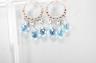 A pair of 14k white metal, diamond chip and three stone facetted blue topaz set drop earrings, 31mm, gross weight 4.5 grams.                                                                                                