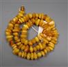 A single strand irregular shaped amber bead necklace, gross weight 73 grams, 62cm.                                                     