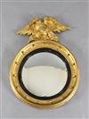 A Regency giltwood and ebonised circular convex mirror, Diam. 2ft                                                                      