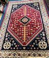 A Persian blue and red medallion rug 300 x 200cm                                                                                       