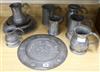 A collection of 18th and 19th century pewter mugs, a dish, etc.                                                                        