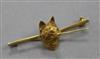 A yellow metal and gem set fox head bar brooch, 42mm.                                                                                  