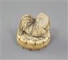 A Japanese ivory netsuke of a cockerel seated on an oval box, 19th century, 4.3cm high (no.524)                                        