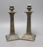 A pair of Japanese square footed embossed plated candlesticks, c.1900, 23cm tall                                                                                                                                            