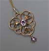 A 9ct gold and amethyst set open work pendant, on a 9ct gold fine link chain, pendant 38mm.                                            