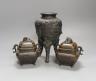 A pair of Japanese bronze censers and covers and a Japanese bronze tripod censer, 23cm tall, (3)                                                                                                                            