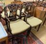 A set of four Edwardian George III style inlaid mahogany dining chairs with arms                                                                                                                                            