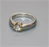 A modern platinum and solitaire diamond ring, in a yellow gold setting, size H.                                                        