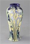 A Moorcroft Macintyre Florian ware small tapered vase, yellow iris design, 16.5cm, small foot chip                                     