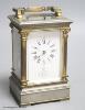 A silvered and gilt brass Corinthian pattern carriage clock, height 17cm                                                                                                                                                    