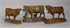 Three Bavarian carved boxwood models of cows with bells                                                                                