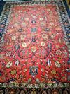 A Persian Heriz red ground rug 310 x 222cm                                                                                             