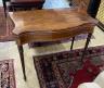 A George III serpentine fronted banded mahogany folding card table, width 88cm, depth 44cm, height 74cm                                                                                                                     