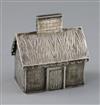 A 19th century Russian silver money box modelled as a dacha, with engraved decoration, coin slot to chimney, KB initials               