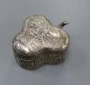 A late Victorian embossed silver clover leaf shaped trinket box, import marks for Chester, 1899, 89mm                                                                                                                       