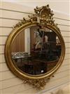 A late Victorian oval giltwood and gesso wall mirror W.108cm                                                                           