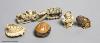 Two Japanese stag antler netsuke, a stained ivory tiger netsuke, a walrus ivory carving and a nut mask netsuke                                                                                                              