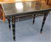 An Edwardian ebonised card table W.94cm                                                                                                