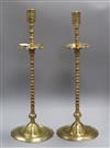 A pair of Benares brass candlesticks height 58cm                                                                                       