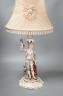 A German porcelain 'matador' lamp and shade 57cm total                                                                                                                                                                      