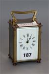 A brass carriage clock                                                                                                                 